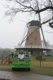 IMG_7318 Marijn and Jenni leaning out van with Just Married sign at windmill.JPG